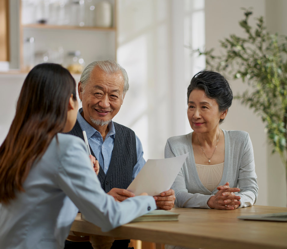 woman and elderly couple talking