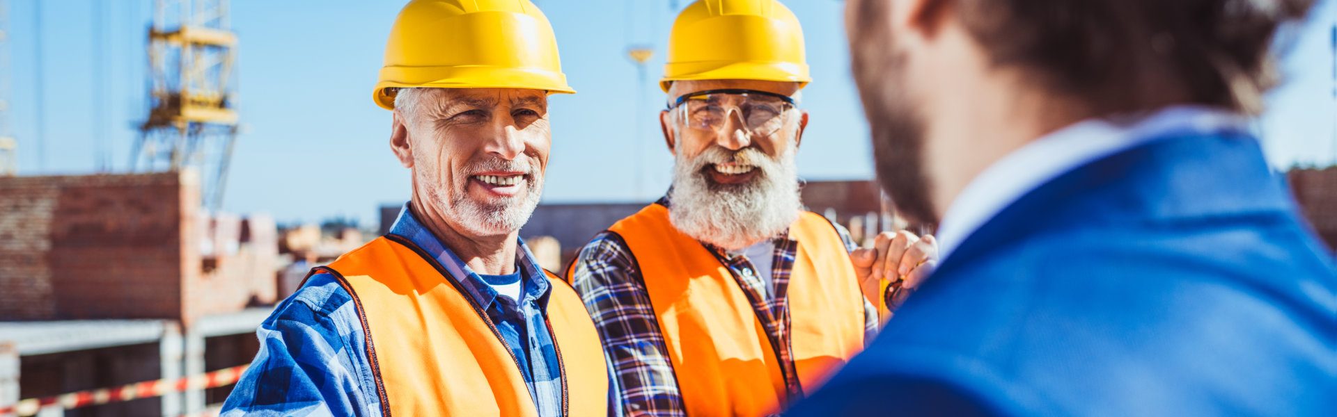 two contractor and a man with suit